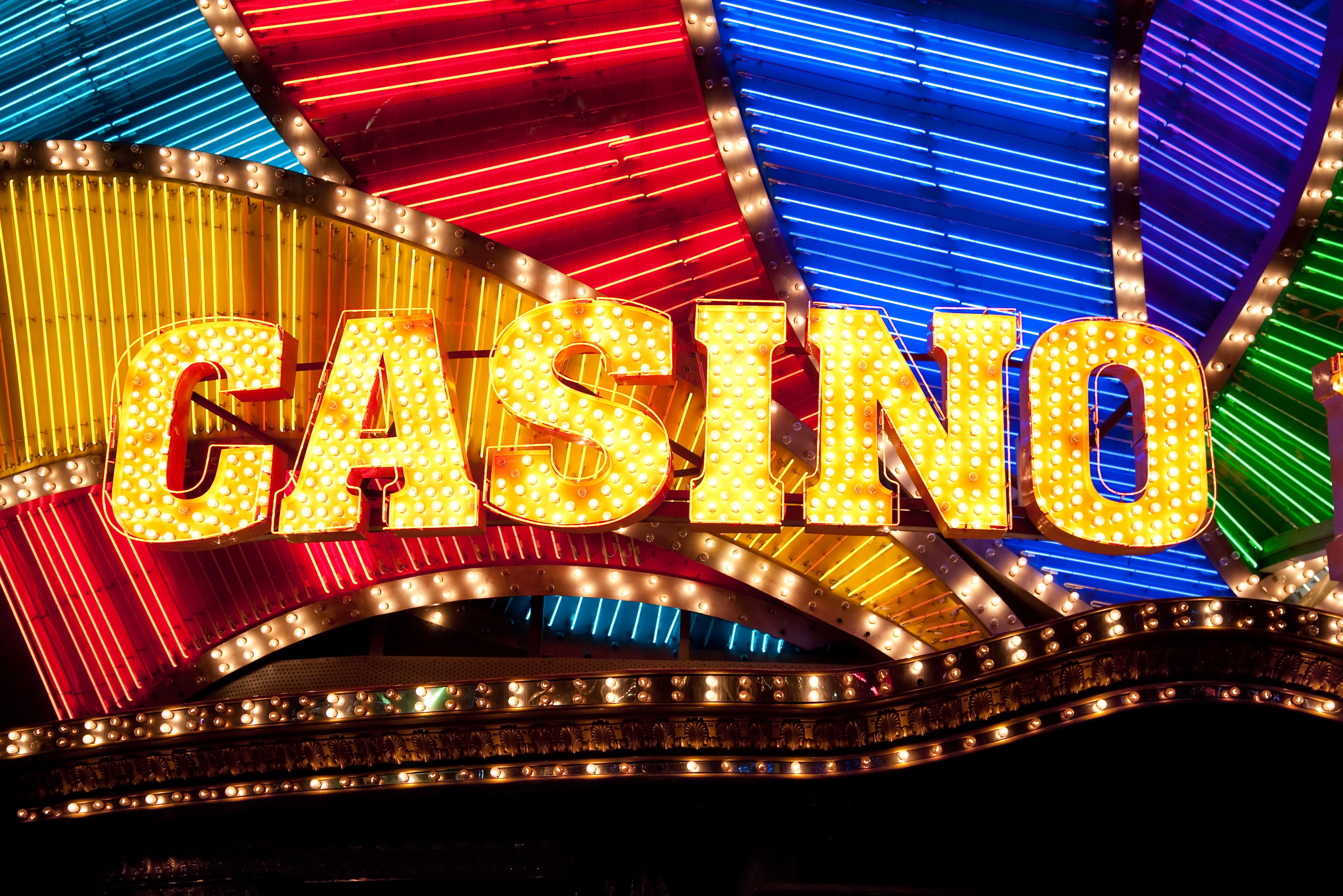 A vibrant graphic showcasing the DoubleU Casino logo with a cascade of gold coins and diamonds.